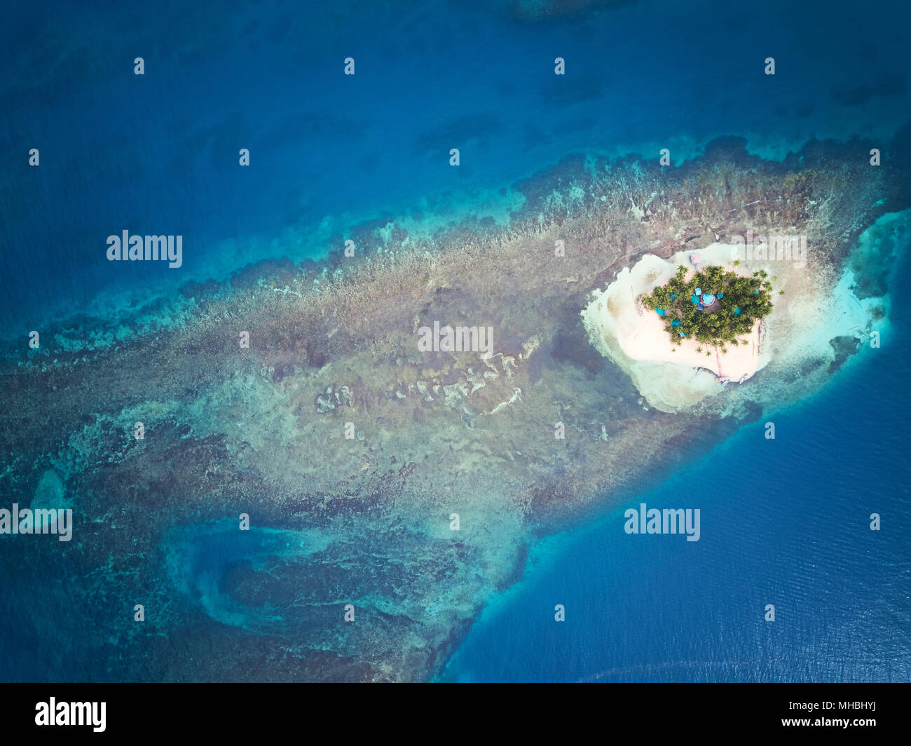 Small island around blue sea water aerial drone view Stock Photo