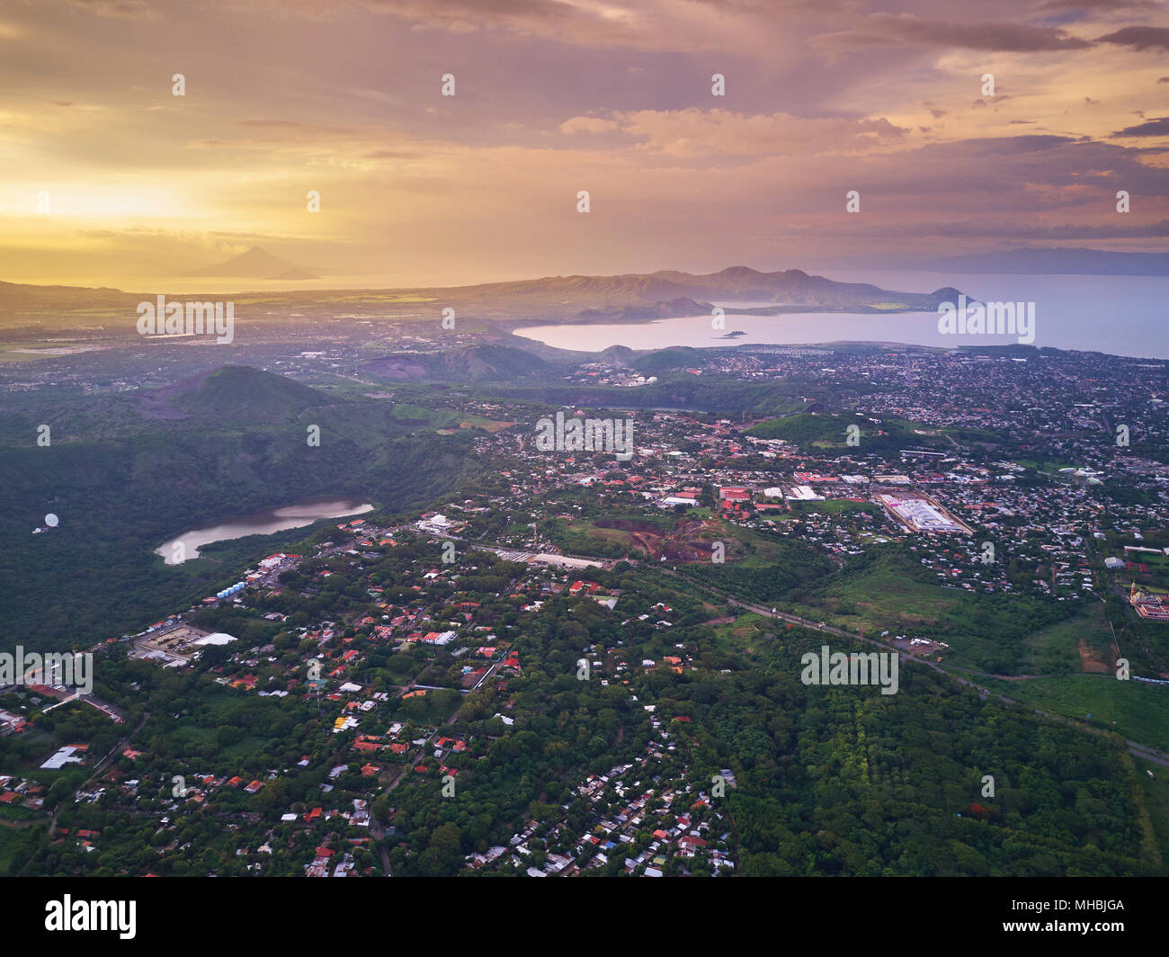 Cityscape of Managua town aerial view in sunset time. Managua landscape capital of Nicaragua Stock Photo