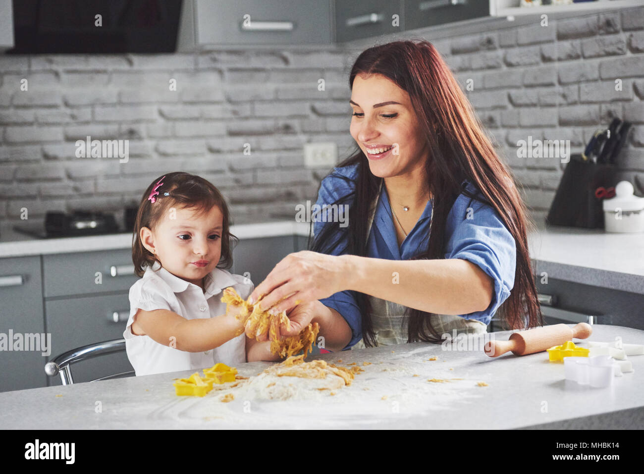 https://c8.alamy.com/comp/MHBK14/happy-family-in-the-kitchen-holiday-food-concept-mother-and-daughter-preparing-the-dough-bake-cookies-happy-family-in-making-cookies-at-home-homemade-food-and-little-helper-MHBK14.jpg