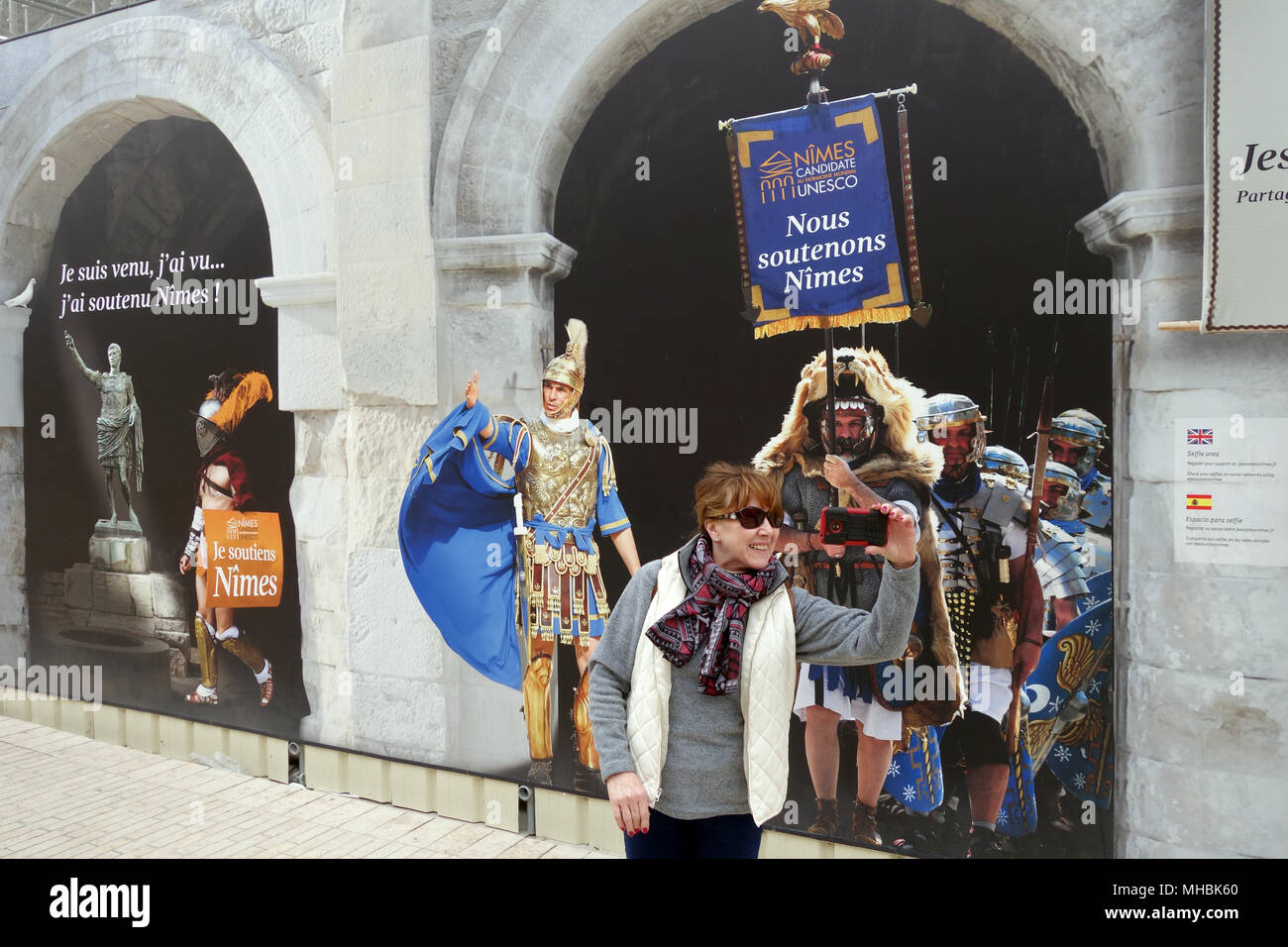 Tourist using the selfie zone outside the Roman Arena in Nimes France 2018 Stock Photo Alamy