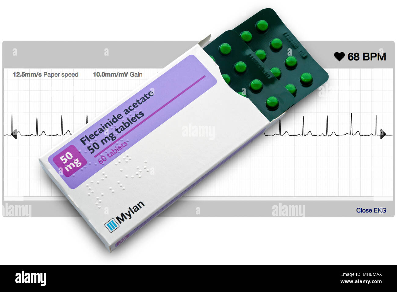 Mylan Flecainide Acetate heart tablets used for treatment of heart arrhythmias including atrial fibrillation with healthy heart ECG trace behind. Stock Photo