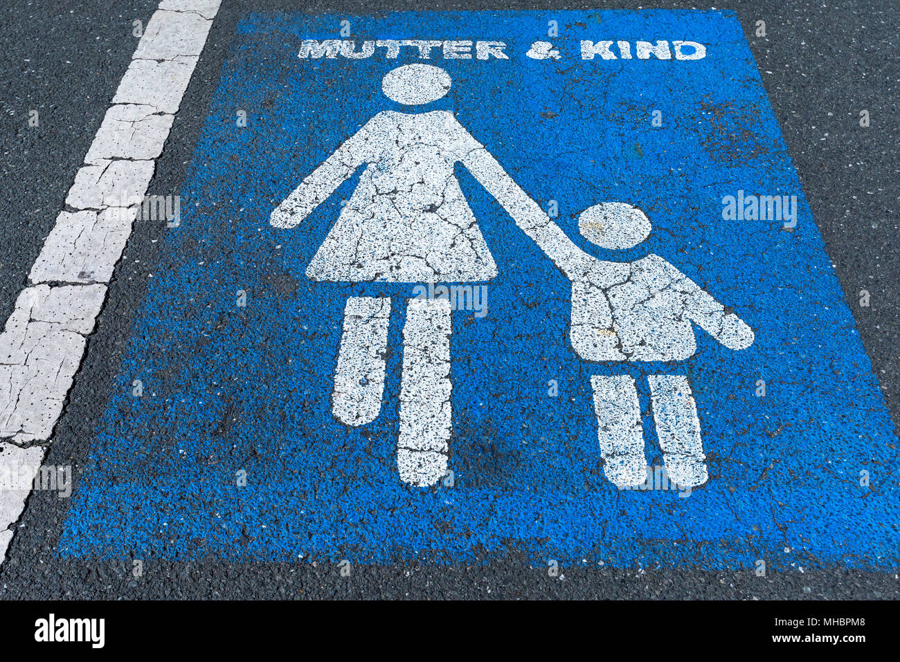 Marking on tar, parking lot for mother and child, Bavaria, Germany Stock Photo
