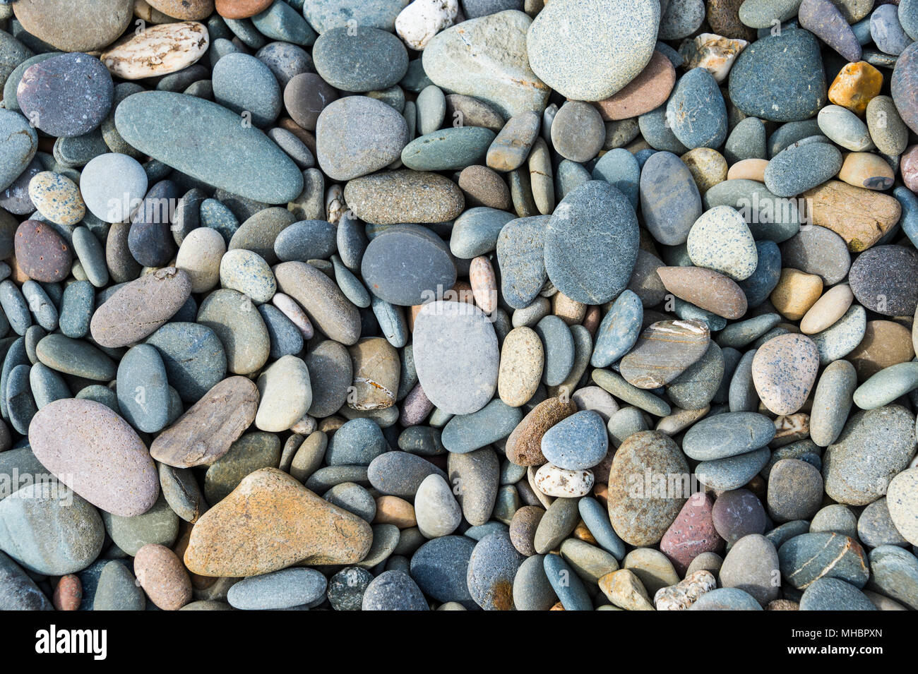 Pebble stones on the north shore of the Isle of Man, United Kingdom Stock Photo