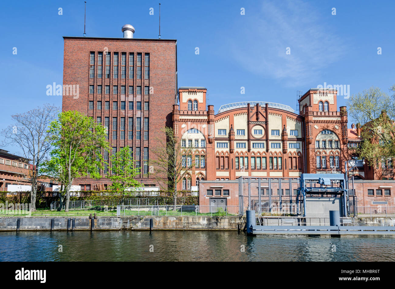 Berlin, Germany - April 22, 2018: Brick Gothic historic machine hall of the cogeneration plant Charlottenburg as seen from the river Spree Stock Photo