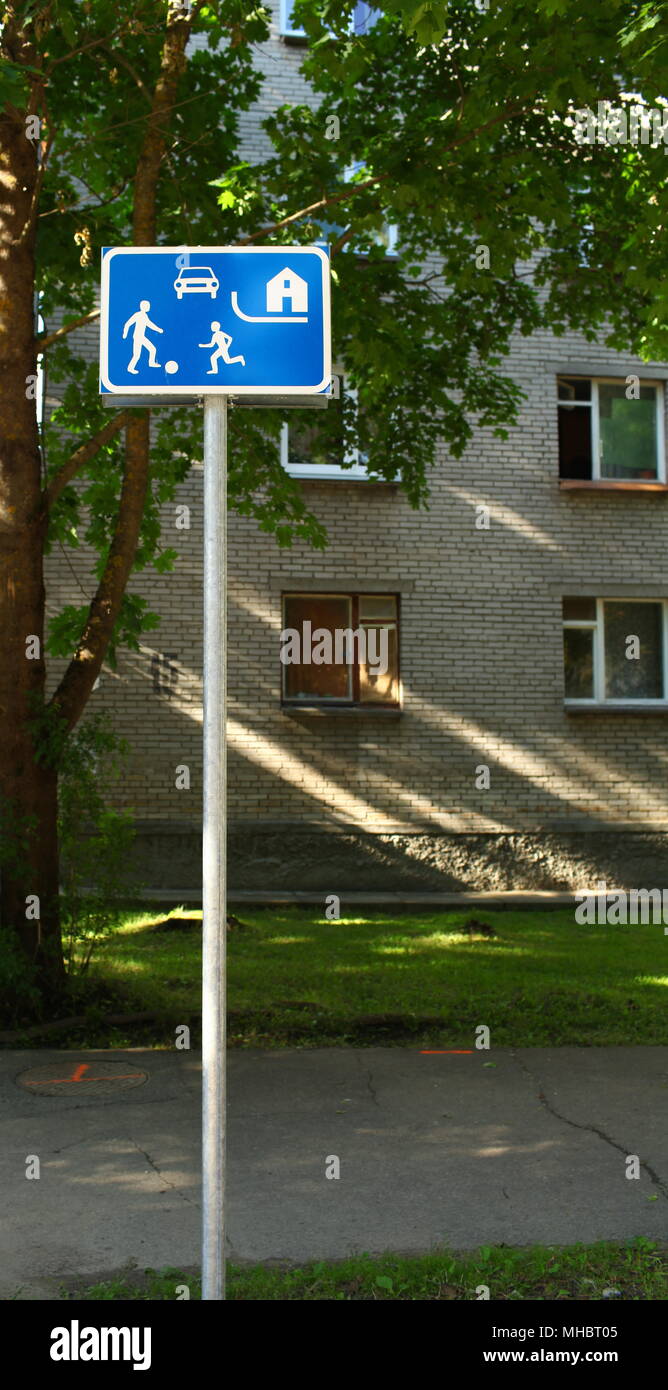 road sign children playing with a ball Stock Photo