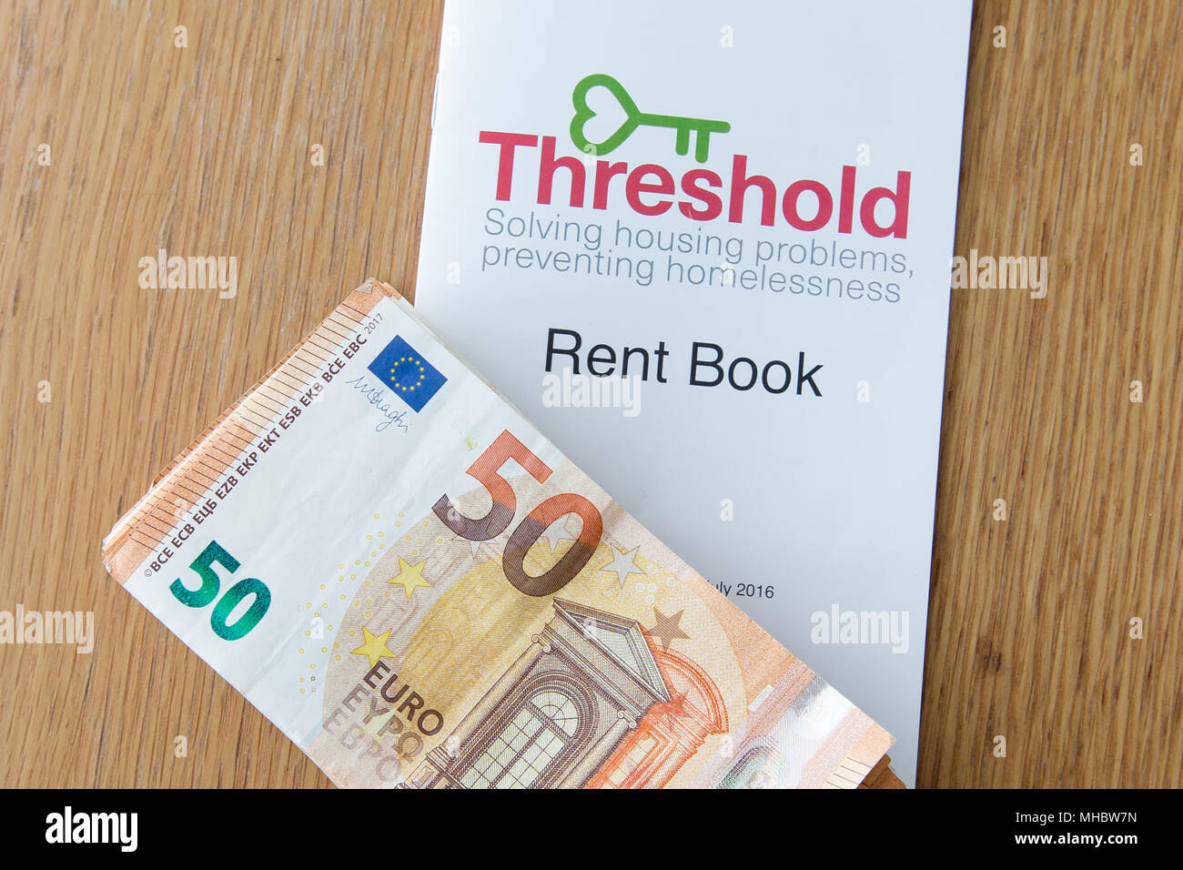 Cash for landlord for rented property and rental book from Threshold. Housing crisis. Cost of living in Ireland rising as rents continue to increase. Stock Photo