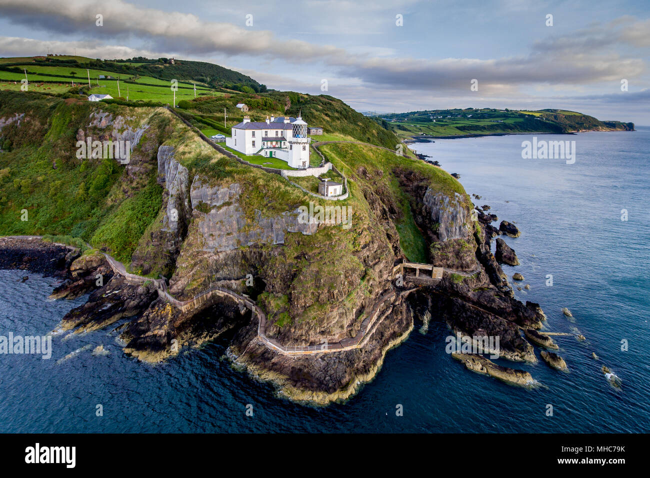 Blackhead Lighthouse on the rugged coastline of County Antrim, Northern Ireland Stock Photo