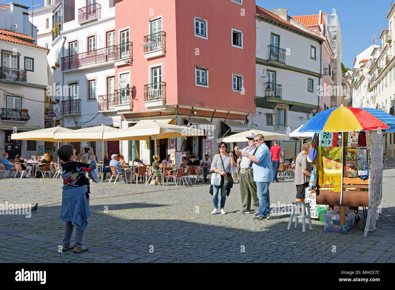 Tourists taking a photo in Alfama, Lisbon, Portugal Stock Photo
