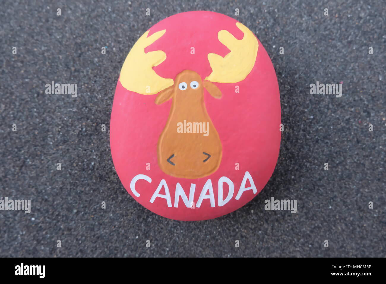 Canada, creative stone design for a unique logo or postcard and a stylized moose Stock Photo