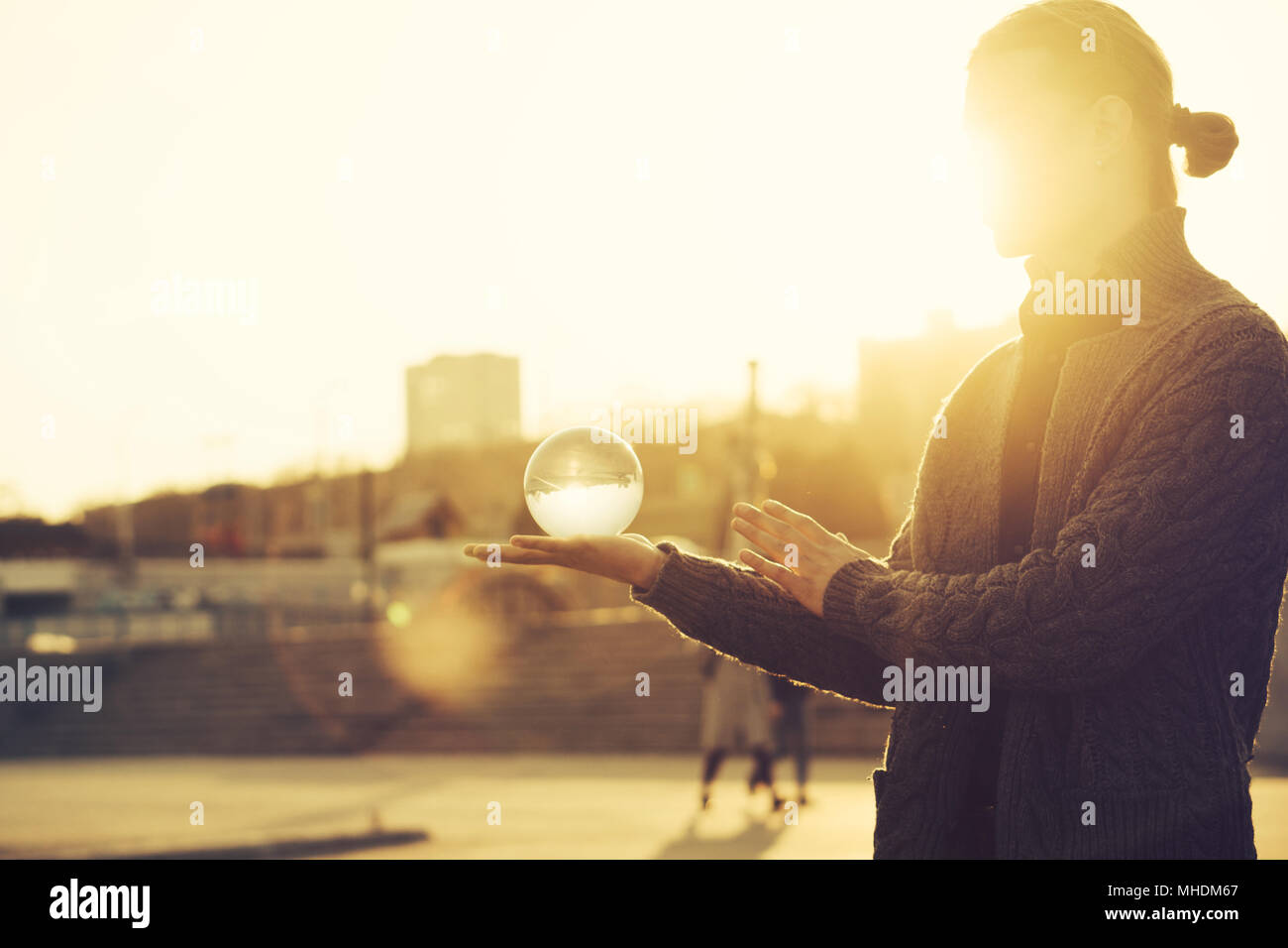 Contact juggling. Man balancing a glass bowl on a hand. Mastery of