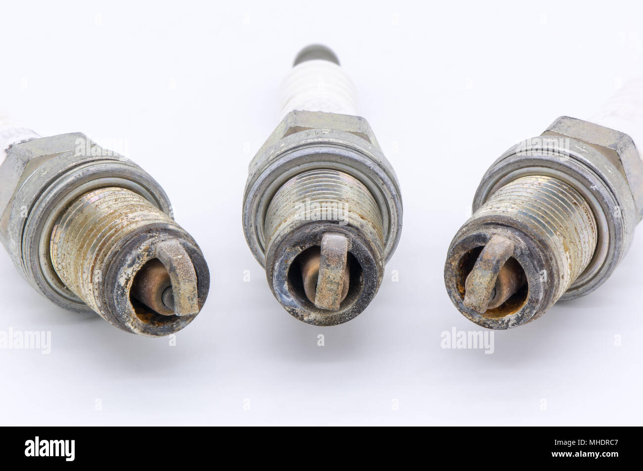 Old spark plug isolated on the white Stock Photo