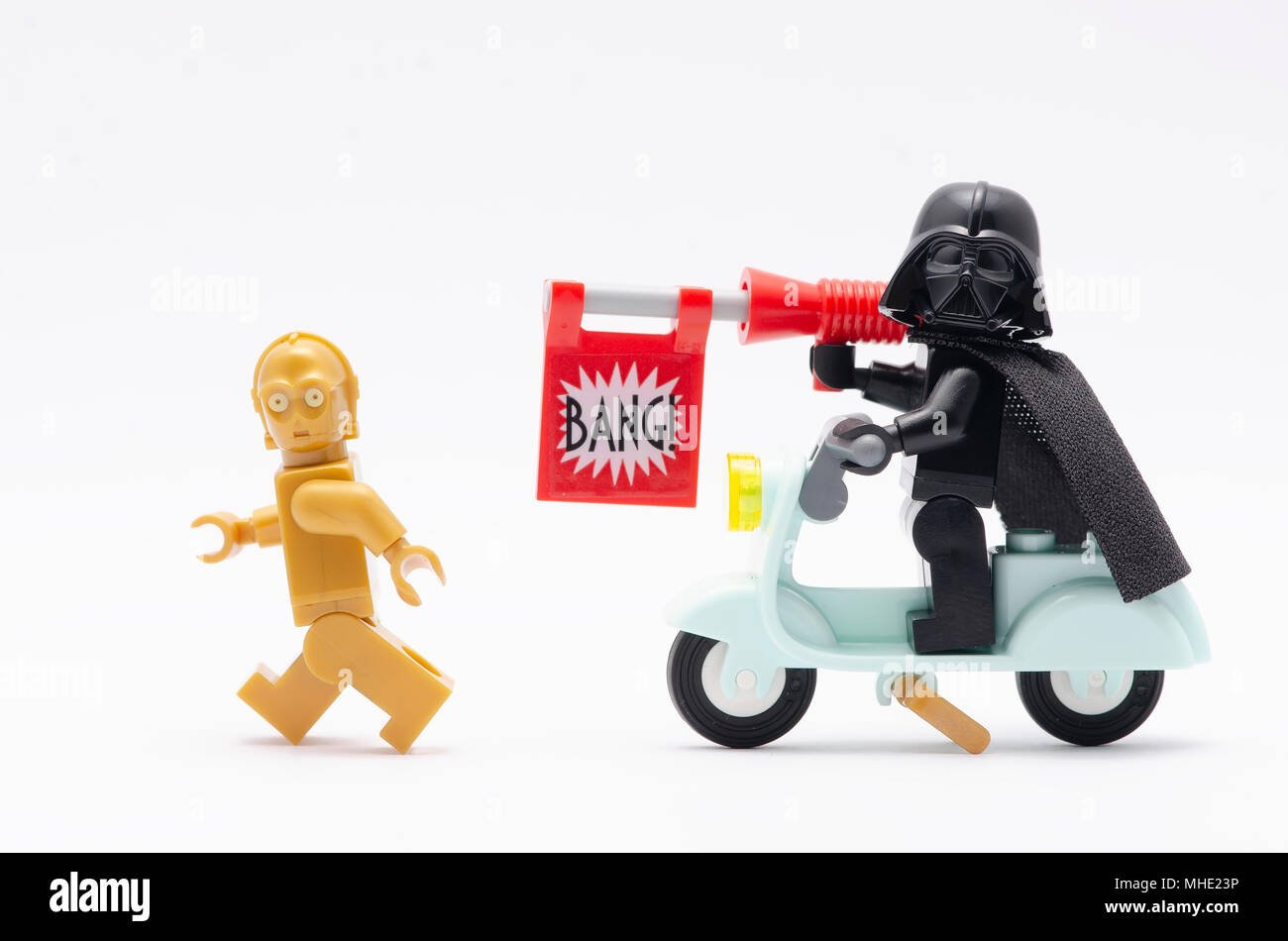 mini figure of darth vader riding scooter with bang gun chasing c3po. Lego  minifigures are manufactured by The Lego Group Stock Photo - Alamy