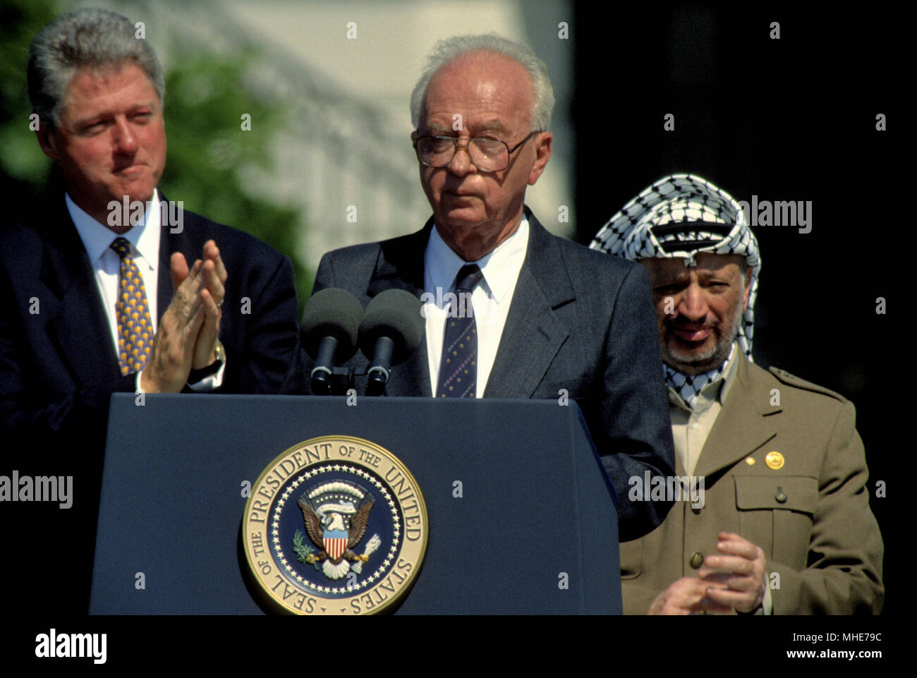 Washington, DC. 9-13-1993 President William Jefferson Clinton hosts the Palestintin  Peace Accords treaty signing on the South Lawn of the White House. Prime Minister Yitzhak Rabin of Israel and the Palestine Liberation Organization chairman, Yasser Arafat, shake hands in a public ceremony at the White House after signing an agreement that granted limited autonomy to Palestine and laid the foundation for future peace talks. William Jefferson 'Bill' Clinton  is an American politician who served from 1993 to 2001 as the 42nd President of the United States. Inaugurated at age 46, he was the third Stock Photo