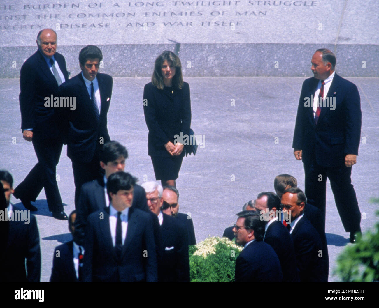 Arlington Virginia, USA, May 23, 1994 John F. Kennedy Jr. his sister Caroline Kennedy Schlossberg, President William Clinton and First Lady Hillary Clinton, Senator Robert Kennedy, along with the rest of the Kennedy family attend the burial of Jacqueline Kennedy Onassis. 'Jackie' was laid to rest next to the eternal flame she lighted three decades ago at the grave of her assassinated husband, the 35th President of the United States, John F. Kennedy. Credit:Mark Reinstein /MediaPunch Stock Photo