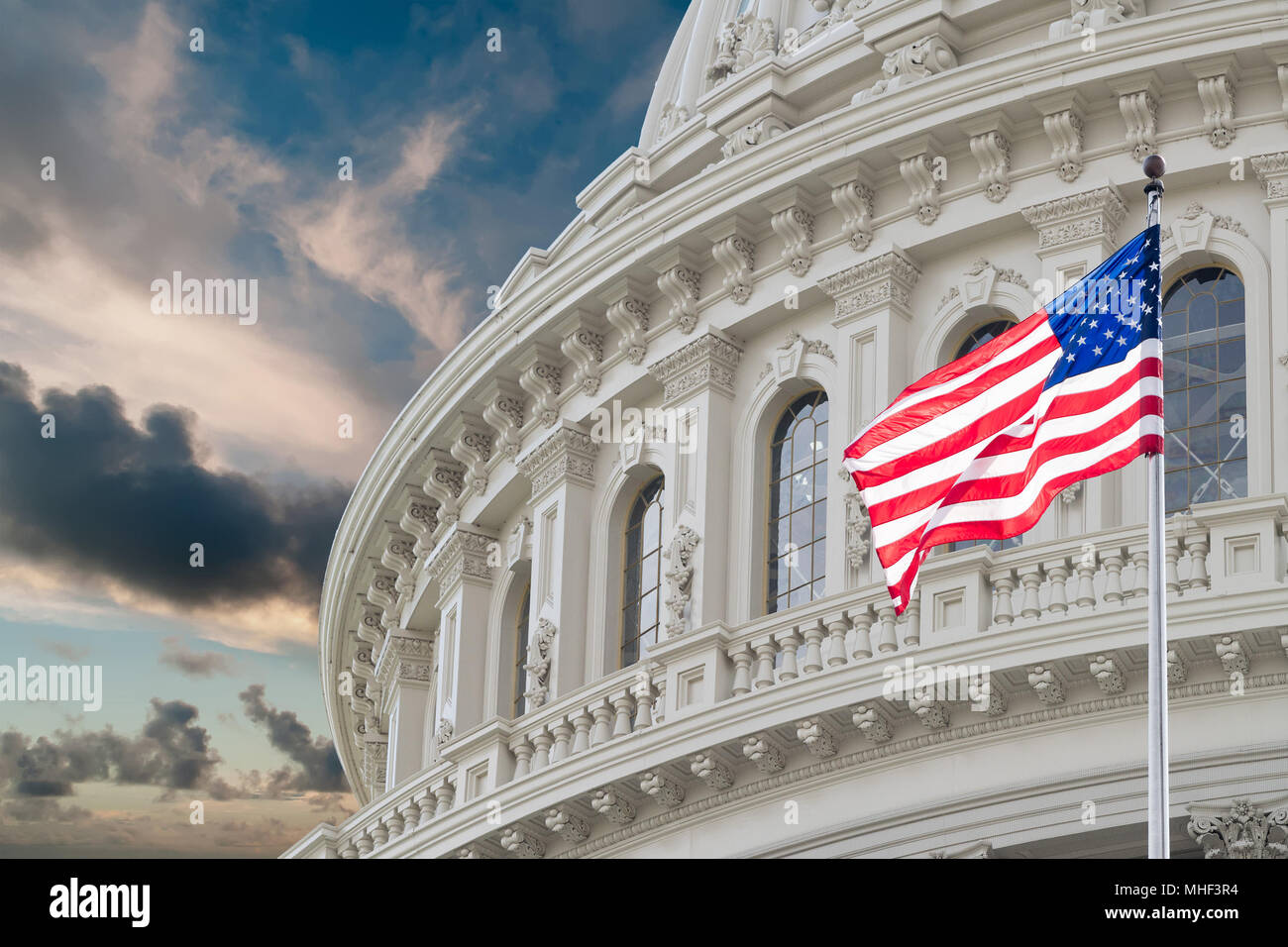 Washington DC Capitol dome detail with waving american flag Stock Photo ...
