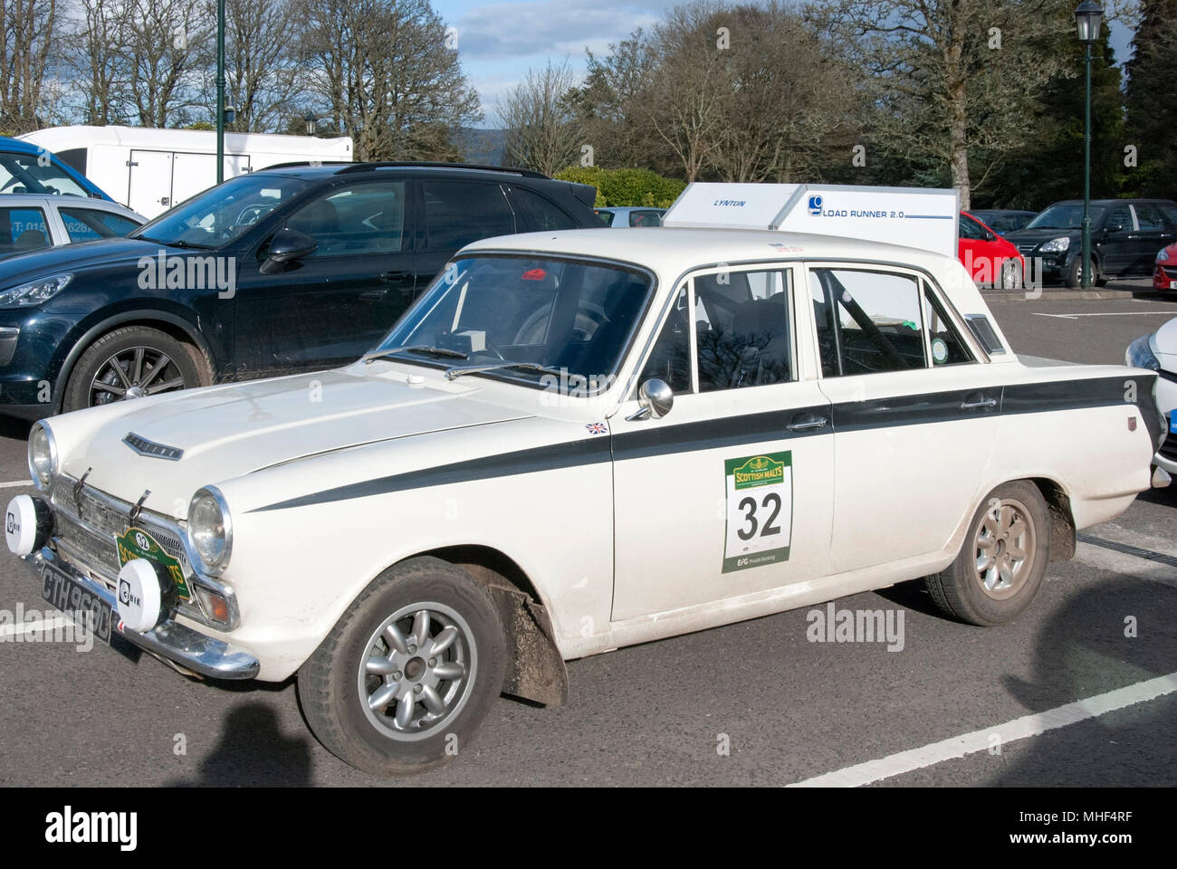 1965 White Ford Cortina GT Mark 1 Rally Car front nearside passenger side view of white right hand drive four door british sport sports saloon car aut Stock Photo