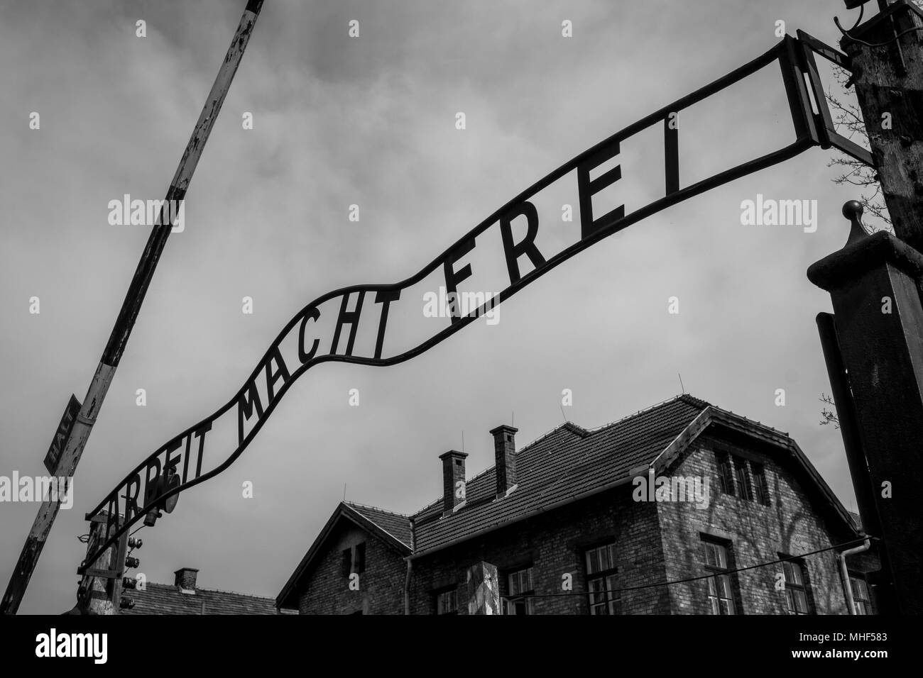 Auschwitz, Poland. Entrance to the Nazi Concentration Camp at Auschwitz 1 showing the sign saying Arbeit Macht Frei - Work Make Frei Stock Photo