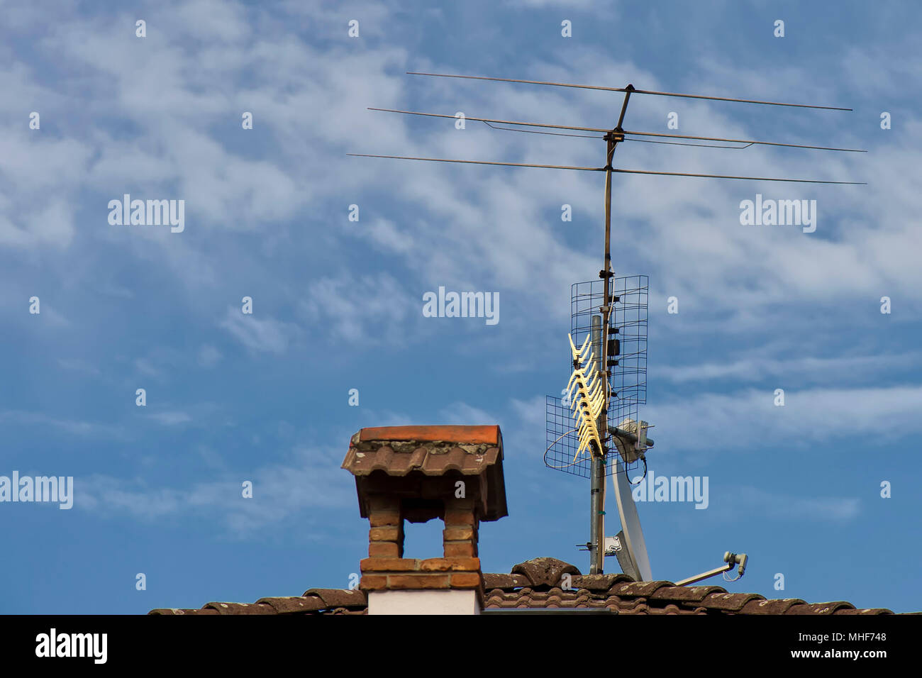 Television antenna on a brick roof Stock Photo Alamy