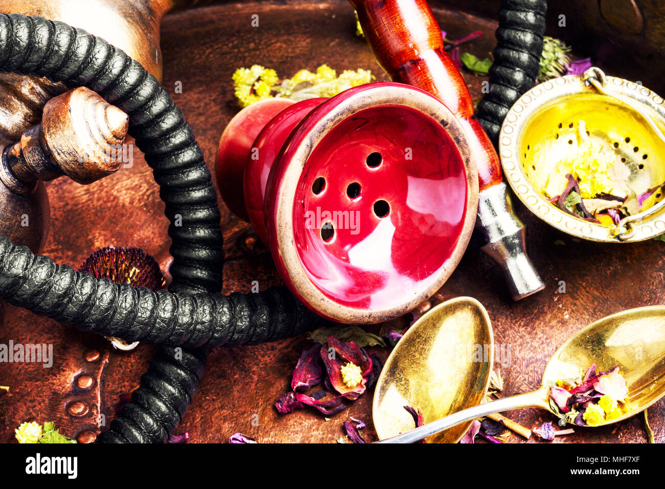 Smoke hookah with herbal floral tea.Shisha concept.Modern hookah Stock