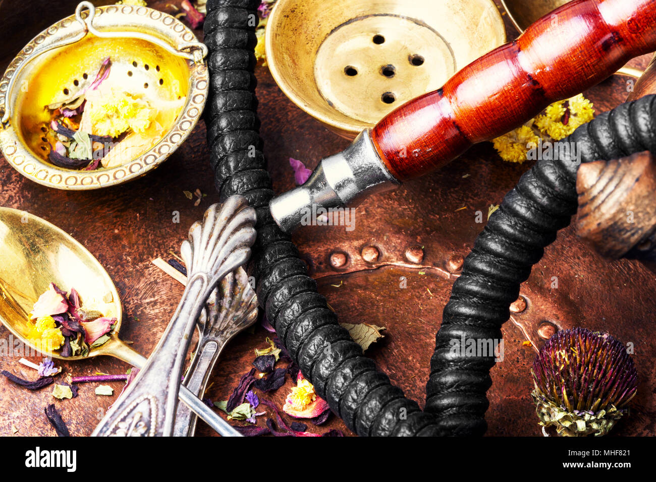 Smoke hookah with herbal floral tea.Shisha concept.Modern hookah Stock