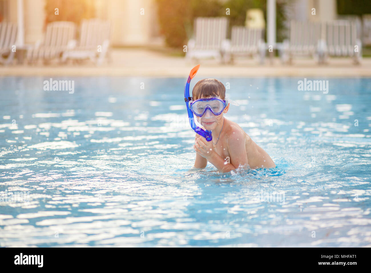 Boy mask snorkeling in pool High Resolution Stock Photography and