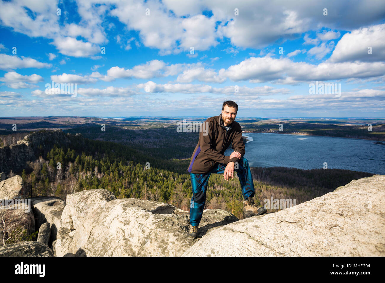 Man sitting on top mountain hi-res stock photography and images - Alamy