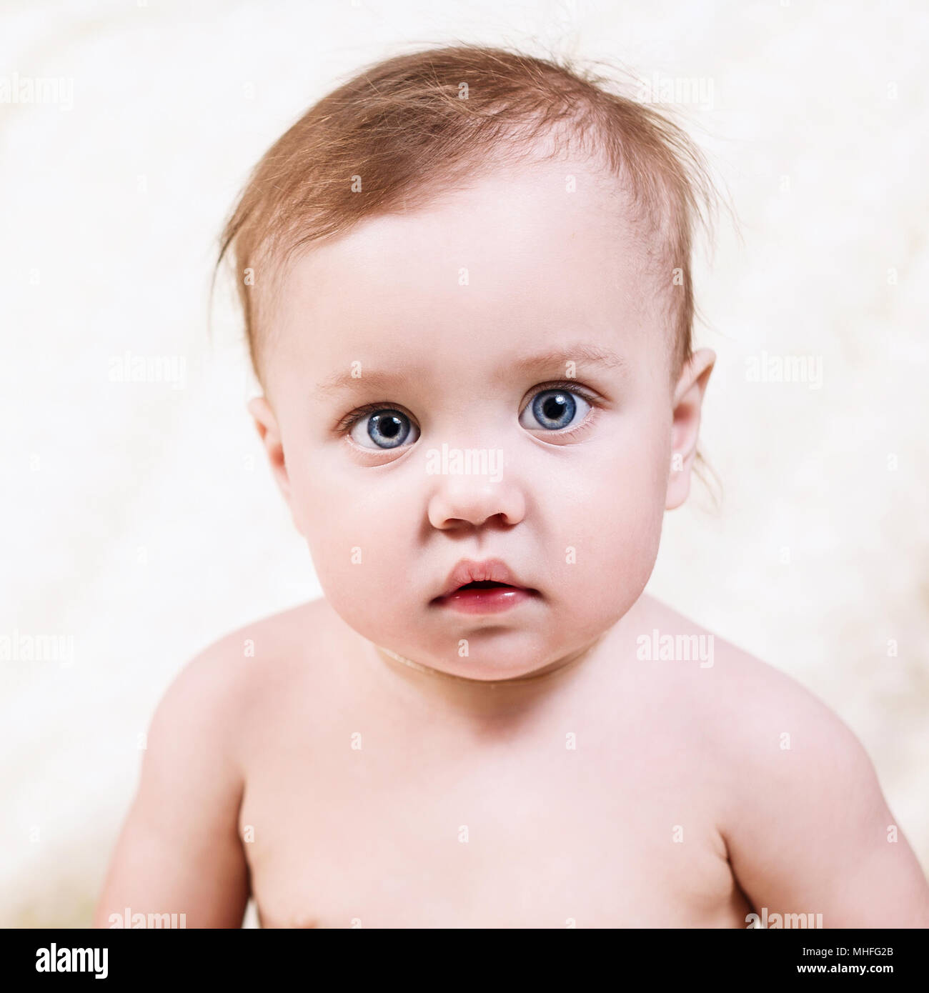 cute little baby looking in the camera. Stock Photo