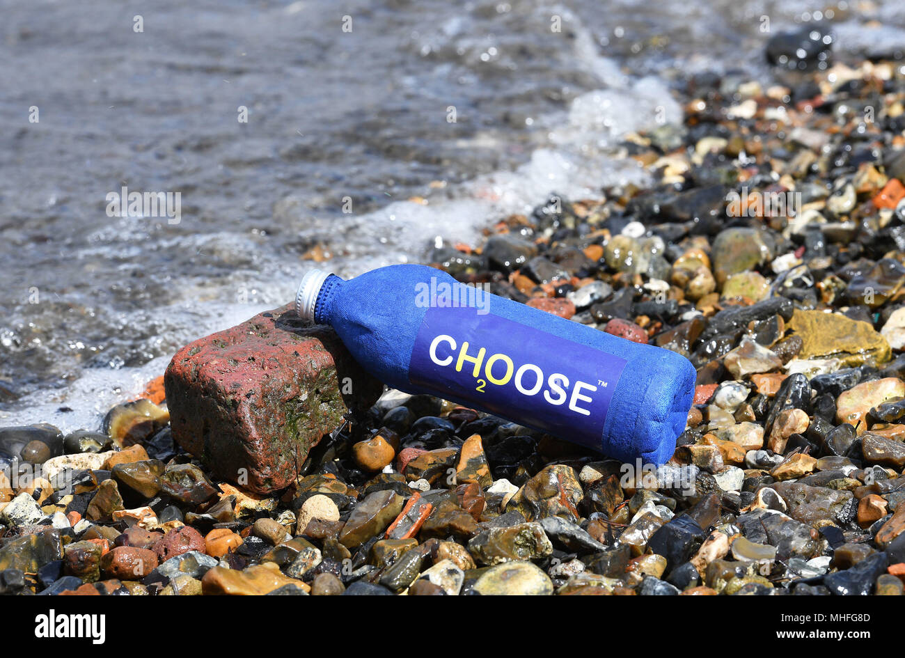 One of the bottle invented by James Longcroft that when immersed in water dissolves away completely, and may help to stop the rise of plastic waste pollution of the seas of the world. Stock Photo