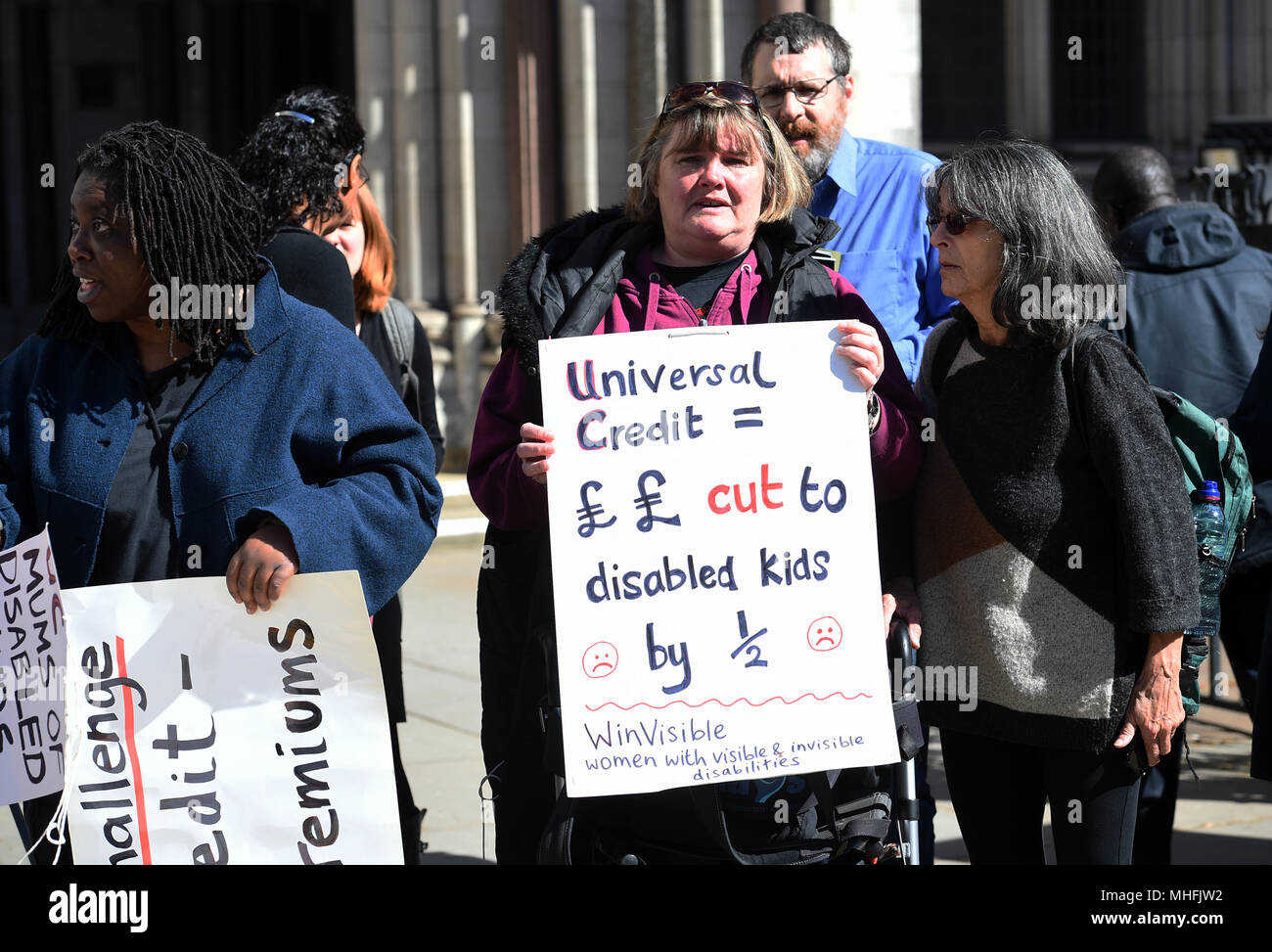 Disability rights campaigners outside the Royal Courts of Justice in London, where motor neurone disease sufferer Noel Conway is to begin an Appeal Court challenge against a 'blanket ban' on assisted dying. Stock Photo