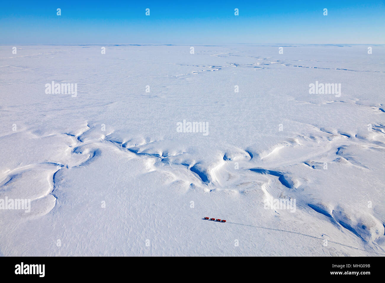 Yamal region, Russia - April 13, 2017: Aerial view of the Group of seismic vibrators in winter tundra of Yamal peninsula during research expedition. S Stock Photo