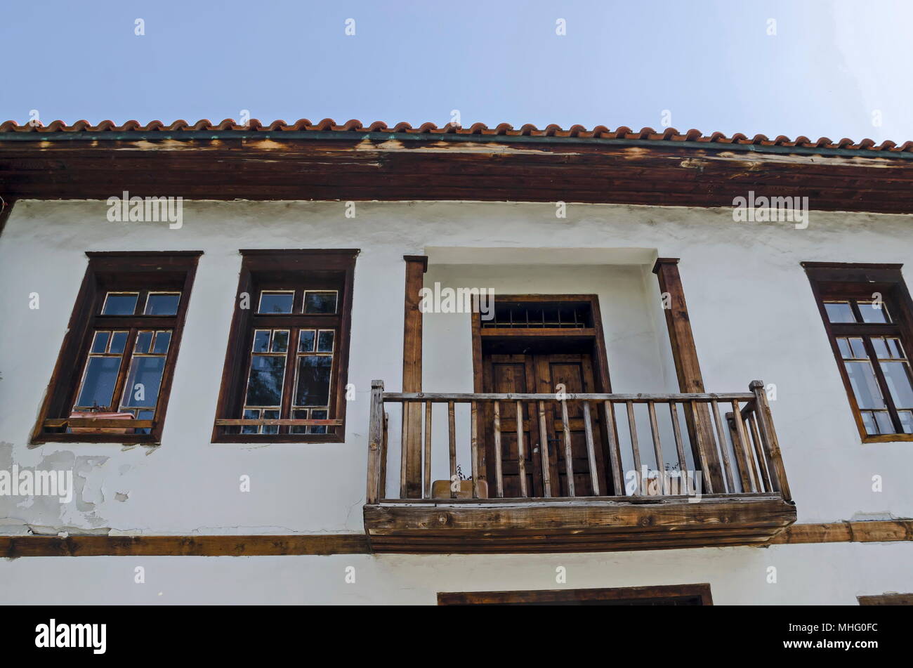 View of balkony, door and windows at the  authentic  ancient  house from hoary antiquity Varosha, Blagoevgrad, Bulgaria Stock Photo
