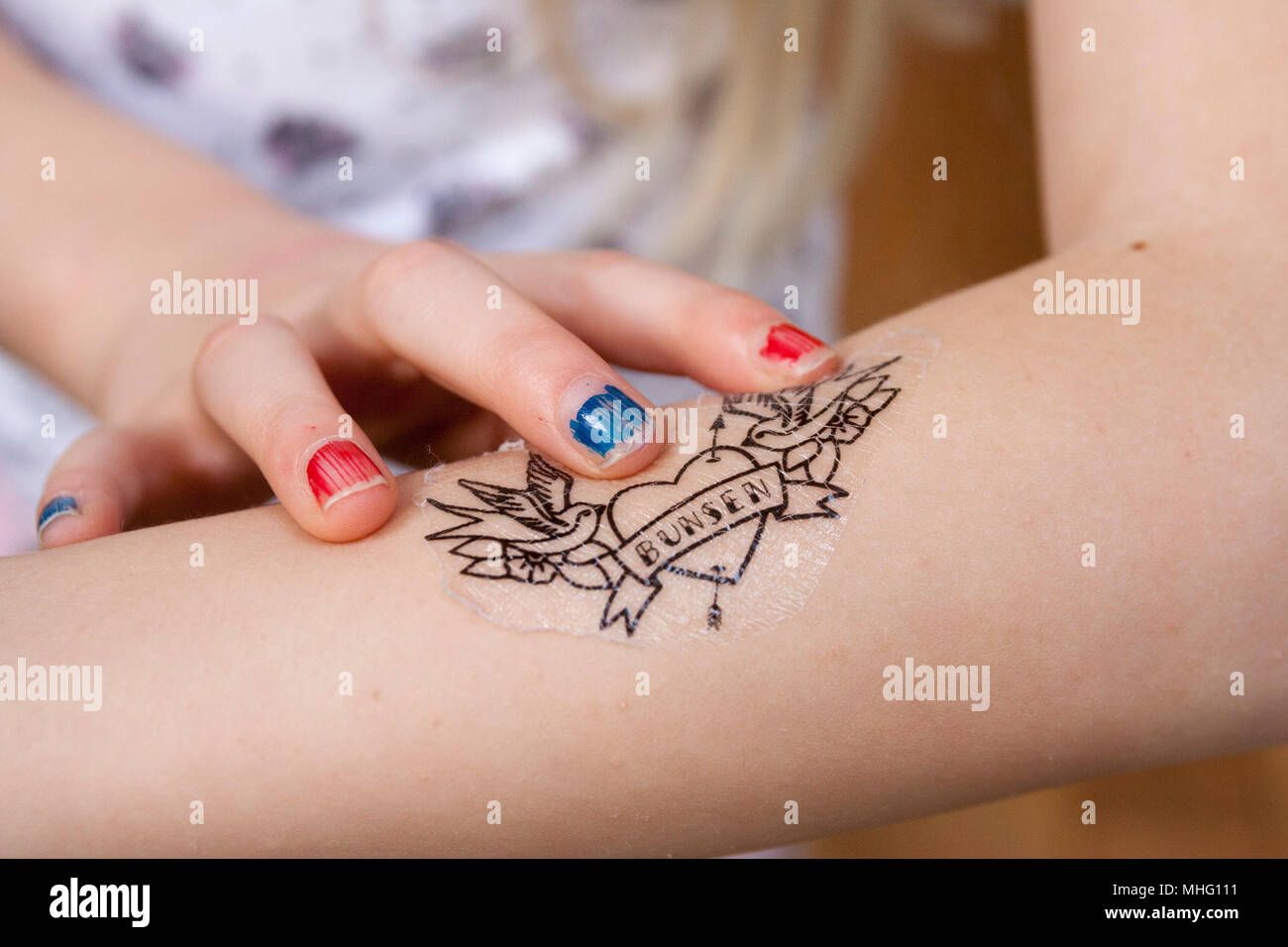 Child playing tattoo hi-res stock photography and images - Alamy