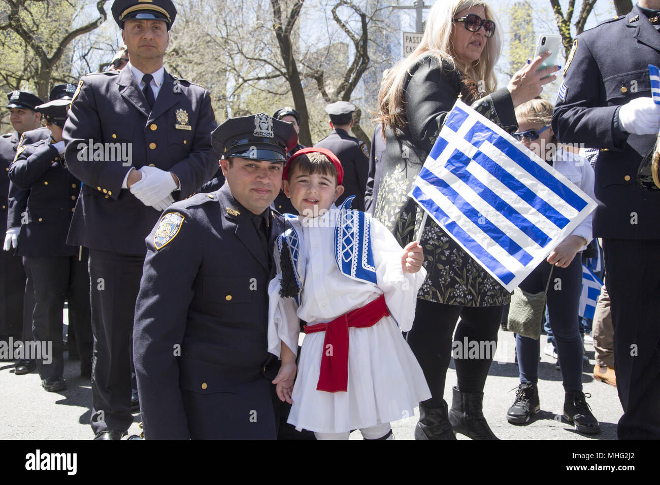 Greek Independence Day Parade in New York City. NYPD officer and son in
