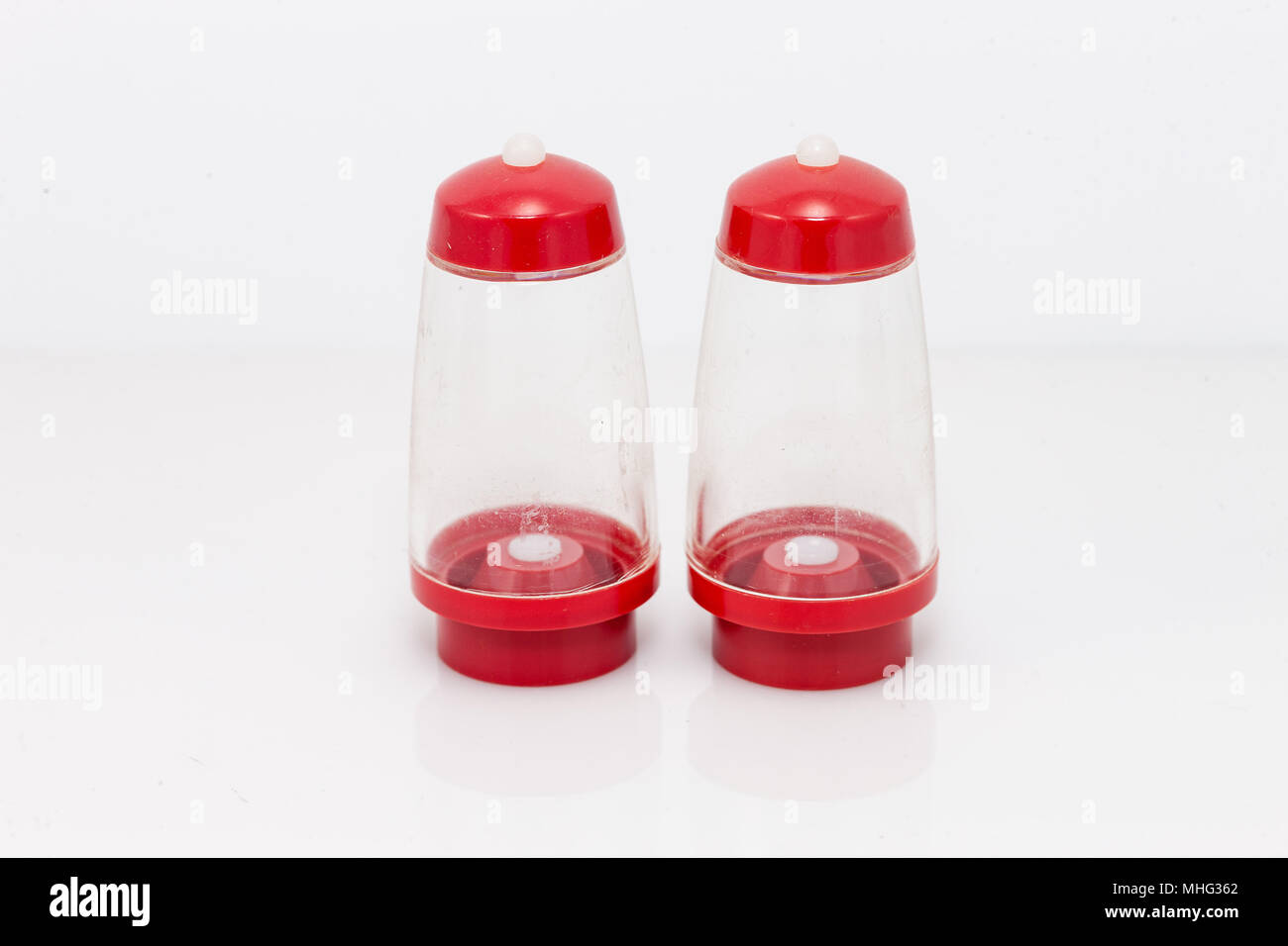 clear with red top and bottom salt and pepper shaker set Stock Photo