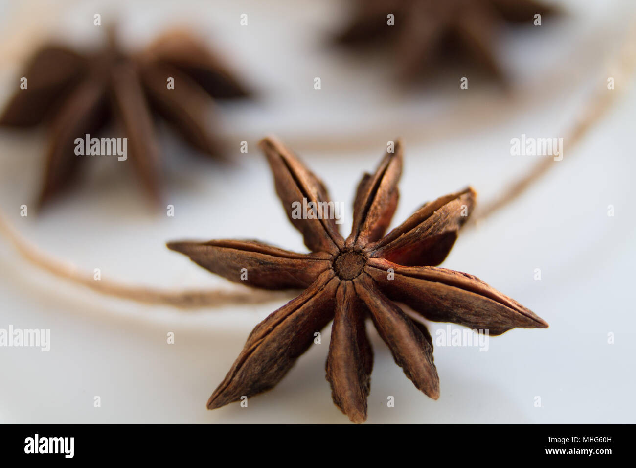 anise tree seeds as spices on a white background Stock Photo