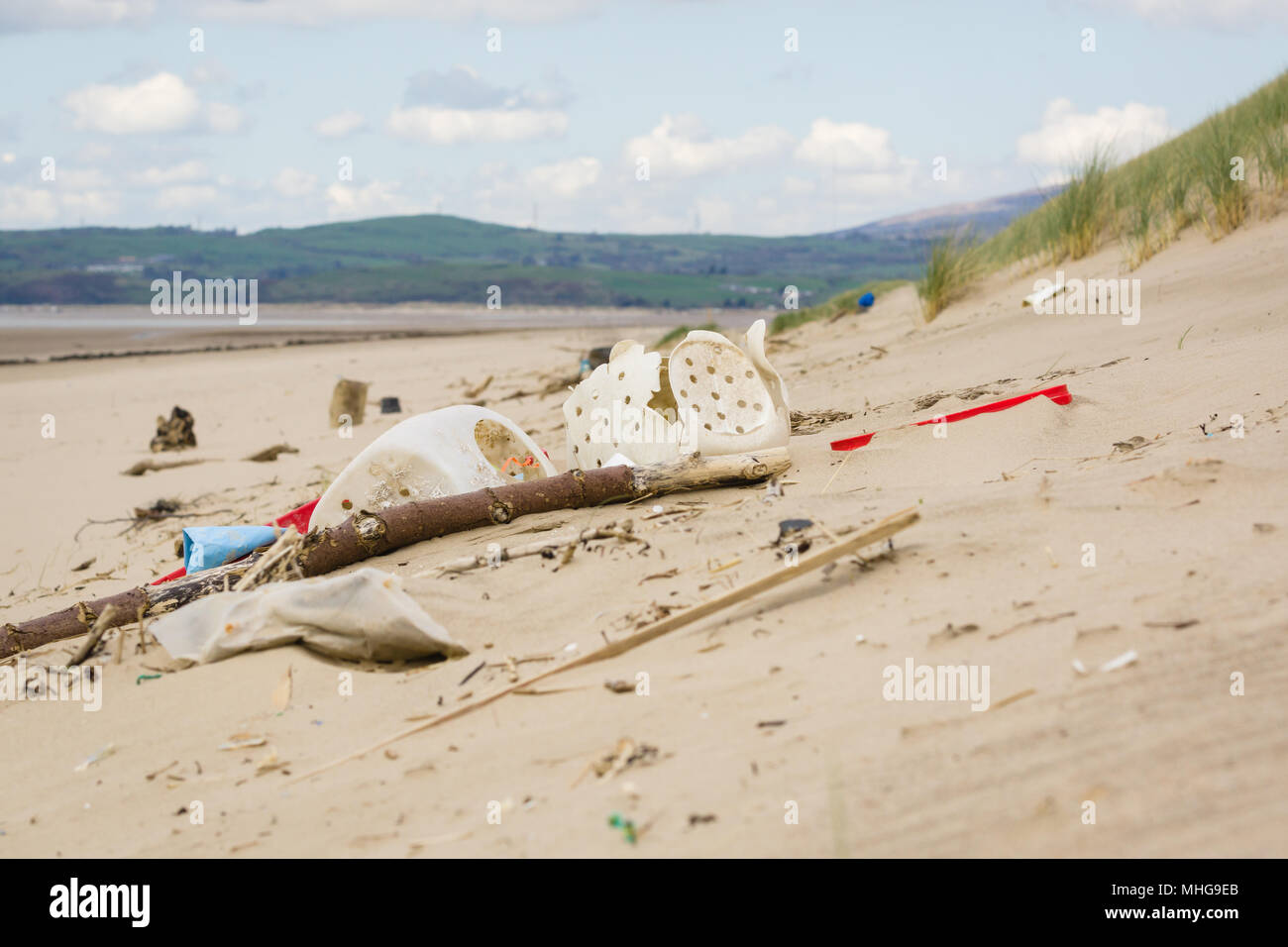 Plastic containers and fishing debris washed up on Harlech beach in West Wales UK an example of plastic pollution in the sea around Britain Stock Photo
