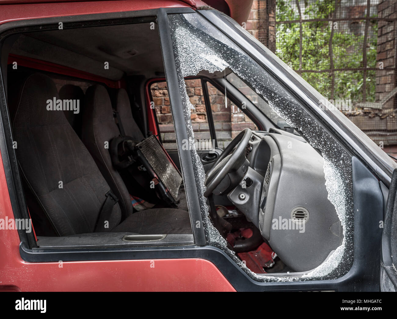 Damaged window pane of a van cracked by theft. Stock Photo