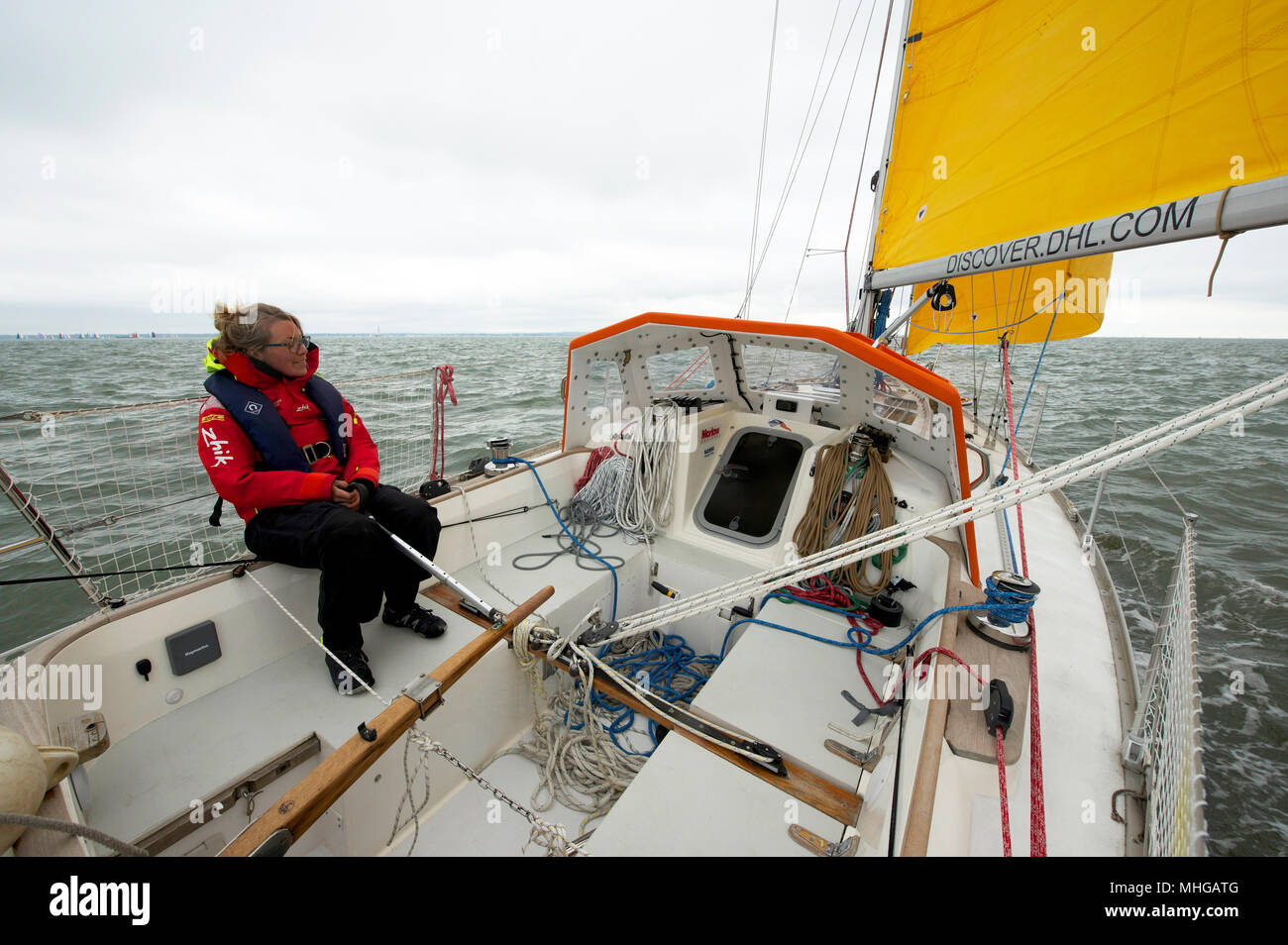Susie Goodall sailing on her yacht DHL Starlight on the Solent, prior to sailing around the world singlehanded in the Golden Globe Race 2018. Stock Photo