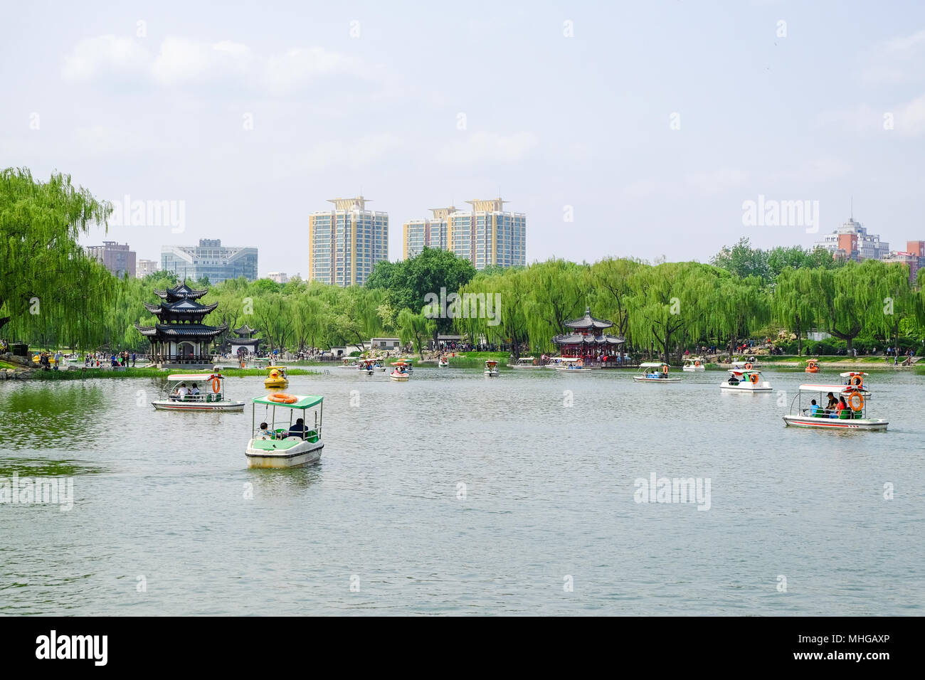 BEIJING, CHINA - APRIL 30, 2018: People are taking a recreational boat ride in a park. Taoranting Park is a major city park located in Xicheng Distric Stock Photo