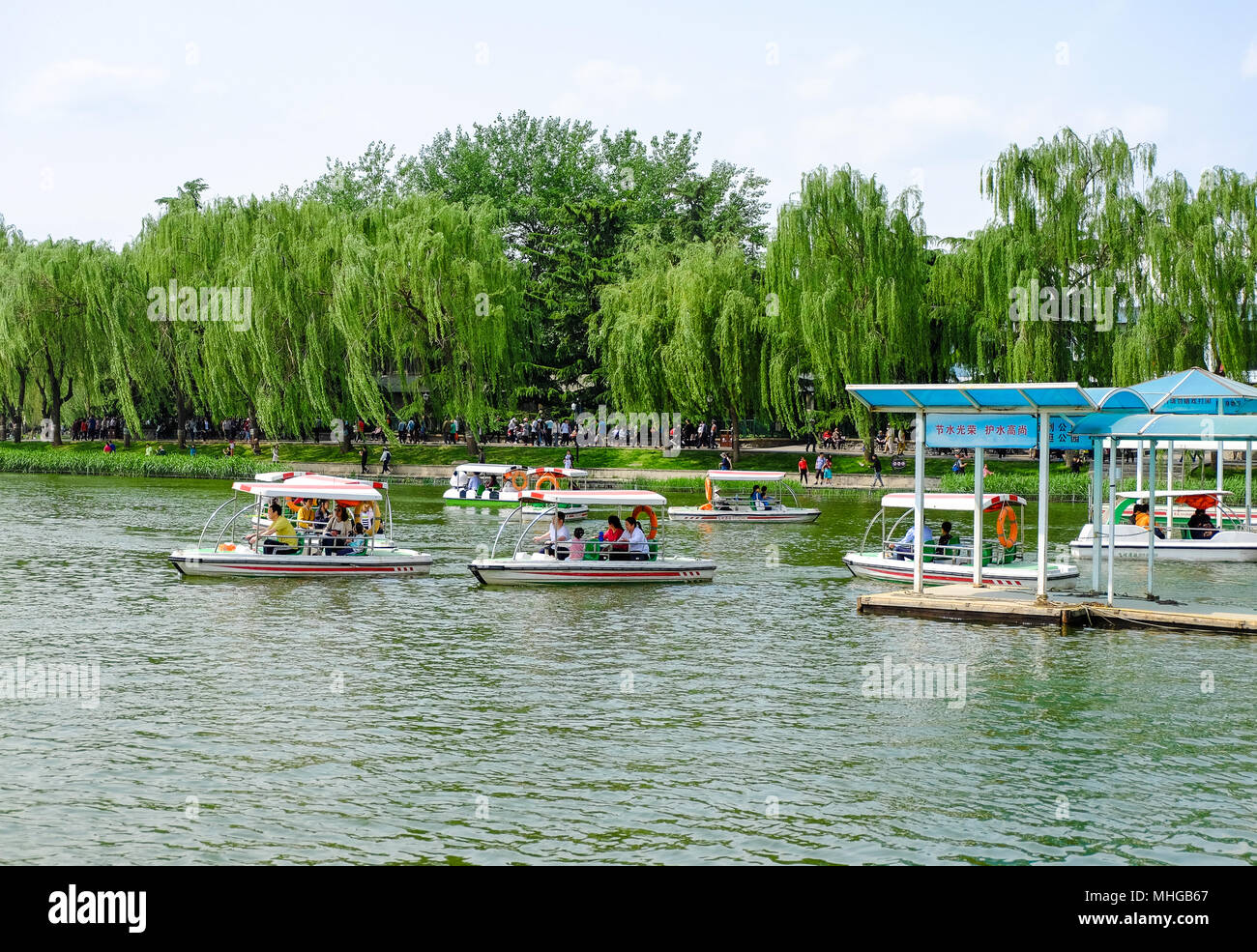 BEIJING, CHINA - APRIL 30, 2018: People are taking a recreational boat ride in a park. Taoranting Park is a major city park located in Xicheng Distric Stock Photo