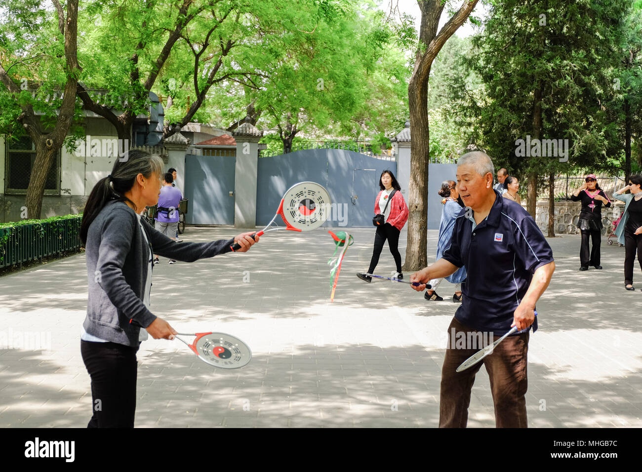 BEIJING, CHINA - APRIL 30, 2018: Chinese racket and ball dance in a park. Taoranting Park is a major city park located in Xicheng District in the sout Stock Photo