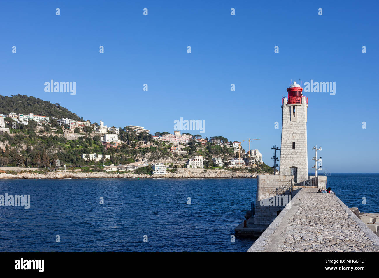 Nice city in France, pier with Phare de Nice lighthouse on Mediterranean Sea Stock Photo