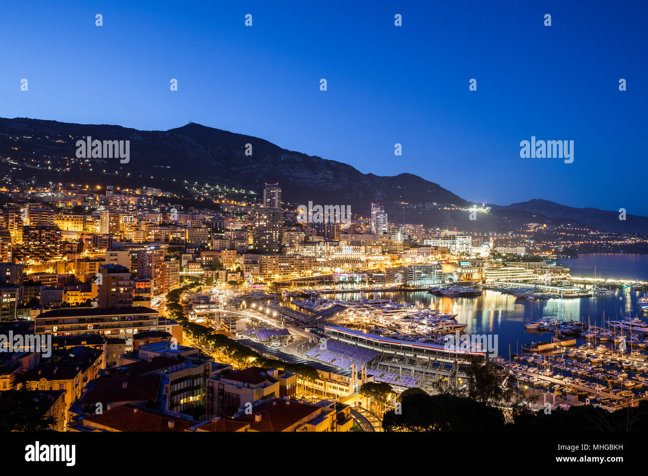 Monaco principality at night, cityscape at the Mediterranean Sea, Europe Stock Photo