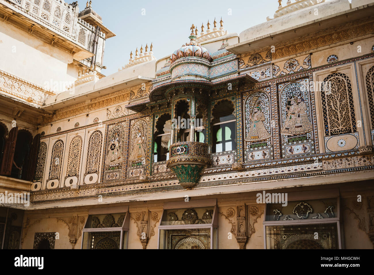 Ornate, gaudy and decorative city palace on a sunny day in Udaipur ...