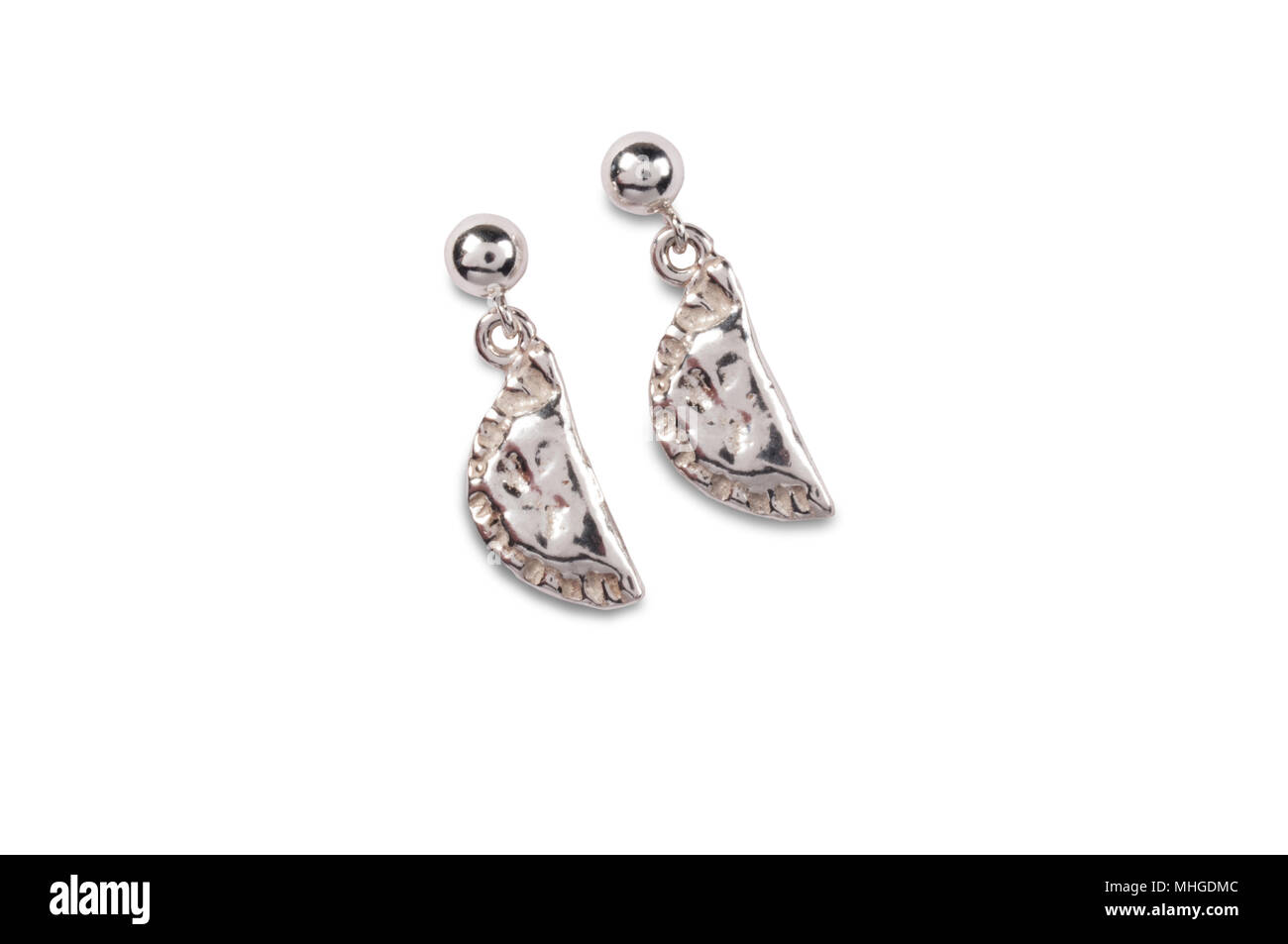studio shot of a pair of pasty shaped earrings isolated on white - John Gollop Stock Photo