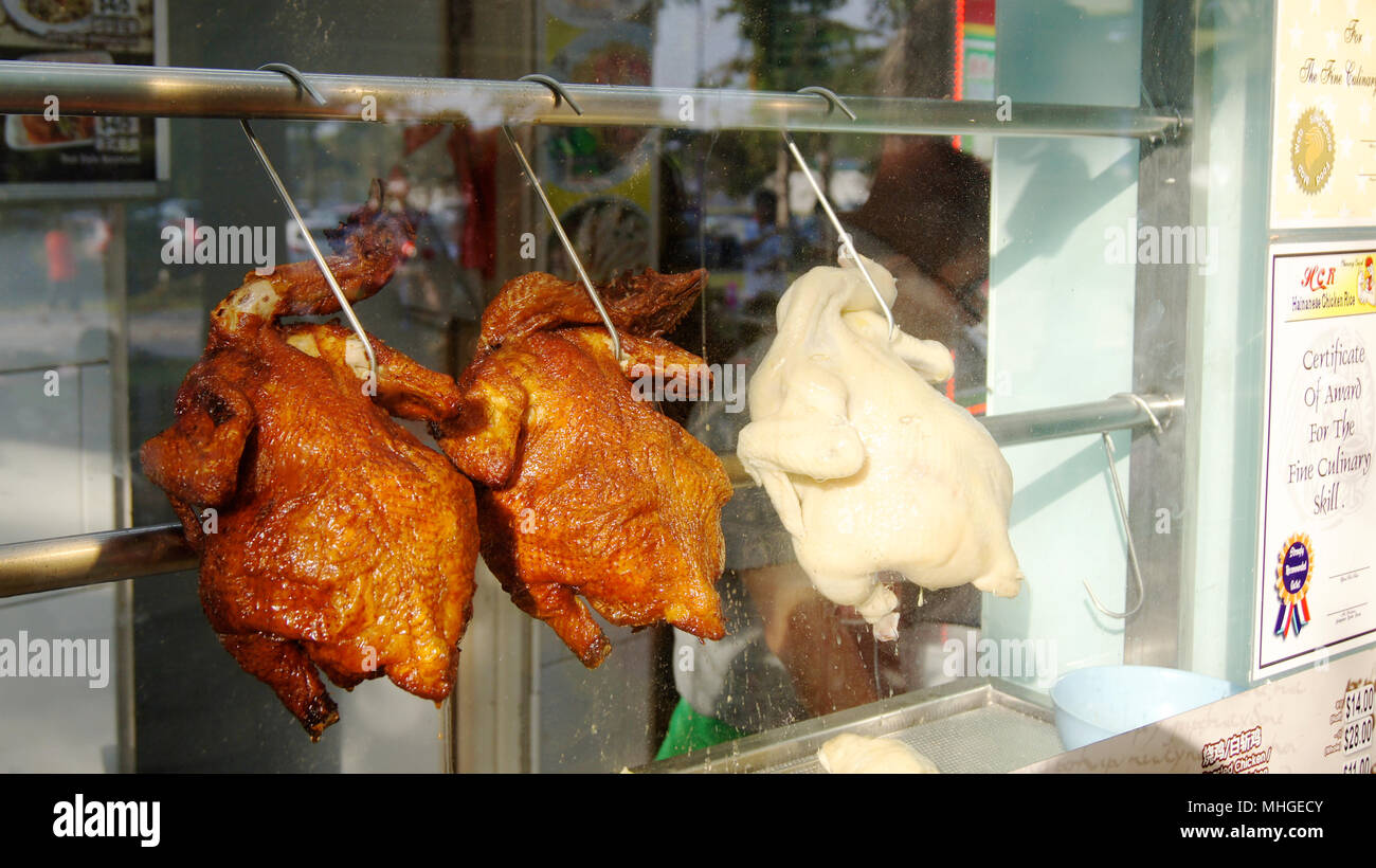 SINGAPORE - APR 3rd 2015: Roasted Beijing ducks hanging for sale at Satay by the bay Stock Photo