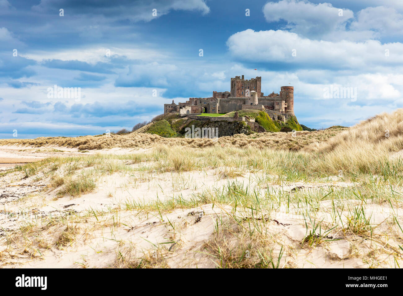 Bamburgh Castle from the sand dunes, Northumberland, England, UK Stock Photo