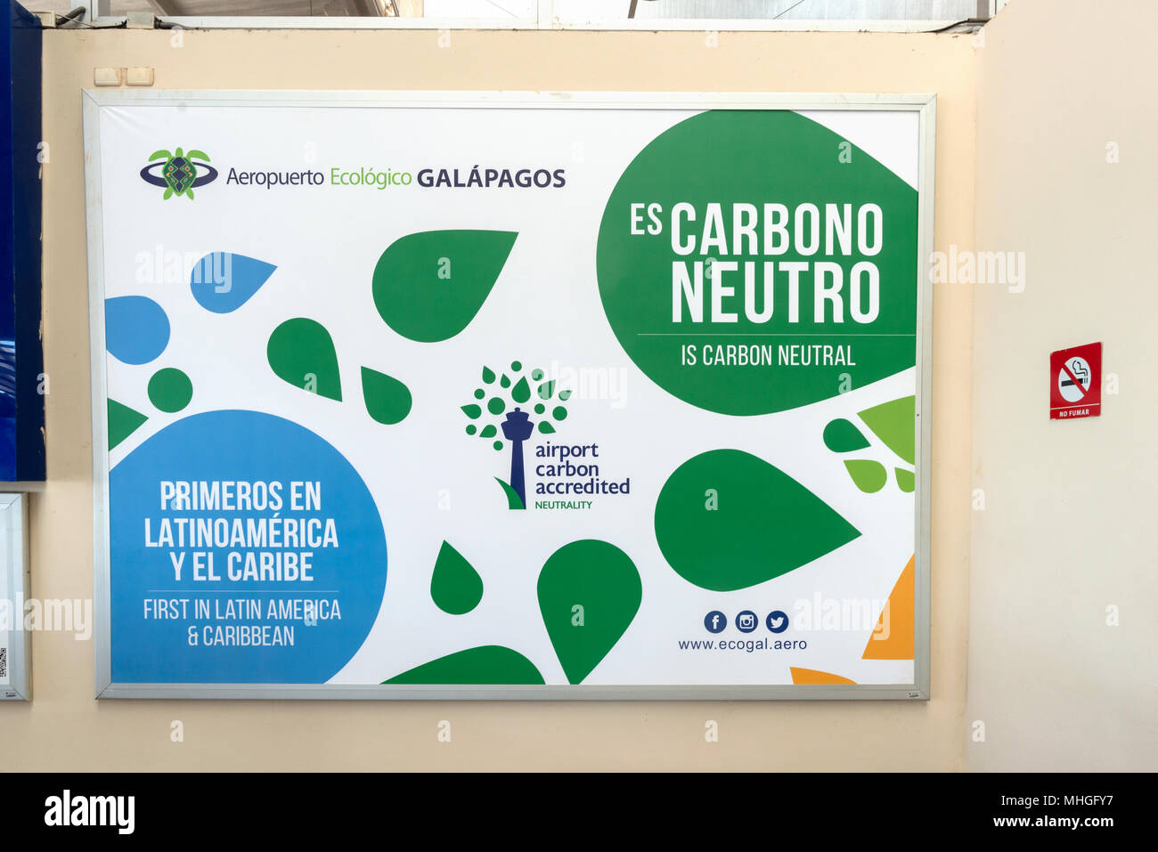 Carbon neutral sign in Seymour Airport terminal on Baltra Island, Galapagos Islands, Ecuador.  The airport is LEED Gold Certified. Stock Photo