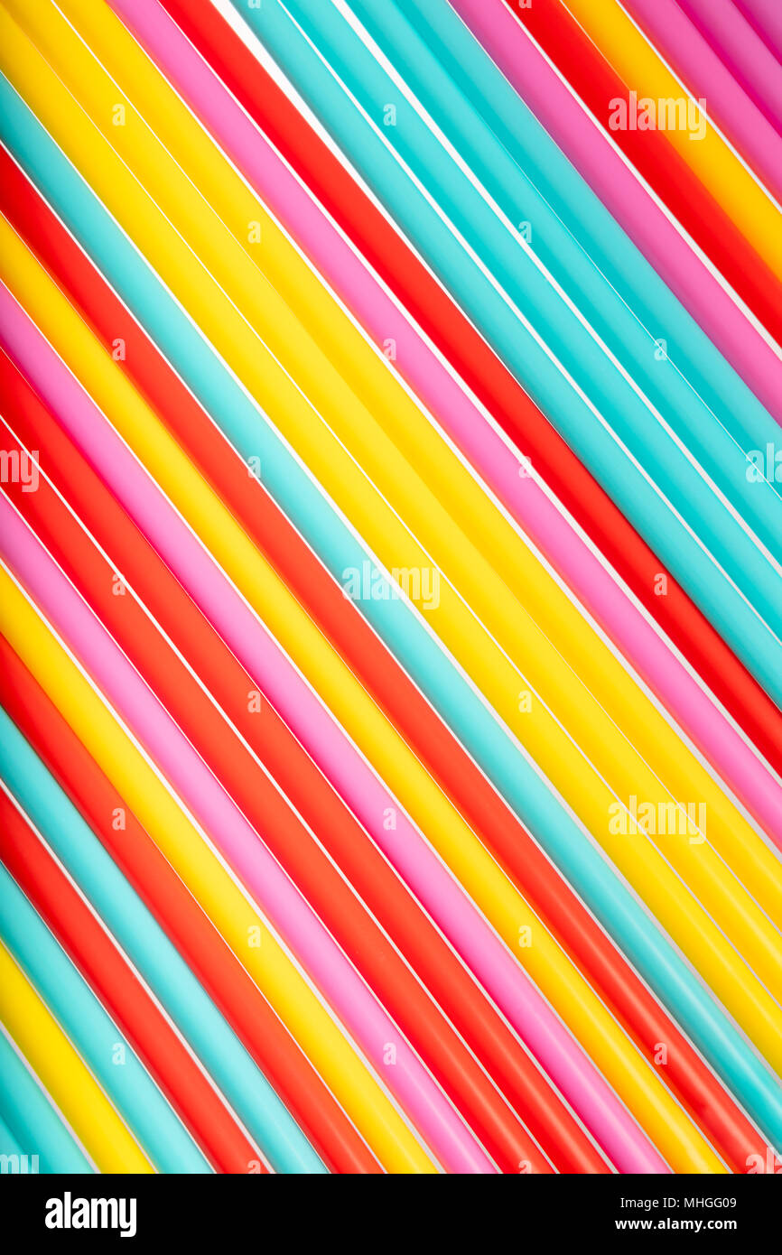 Background with bright color made from many straws, top view, summer conceptual theme, textured background Stock Photo