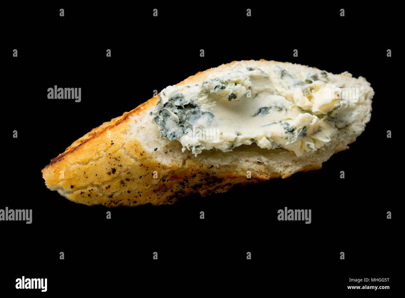 French Saint Agur cheese bought from a supermarket in the UK and spread on a white bread buttered with goats milk butter. Saint Agur is a blue cheese  Stock Photo